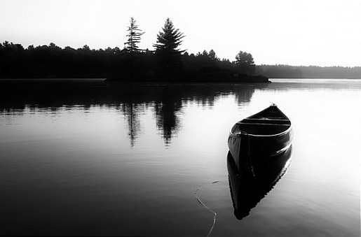 black-and-white-canoe-in-still-water-karl-anderson